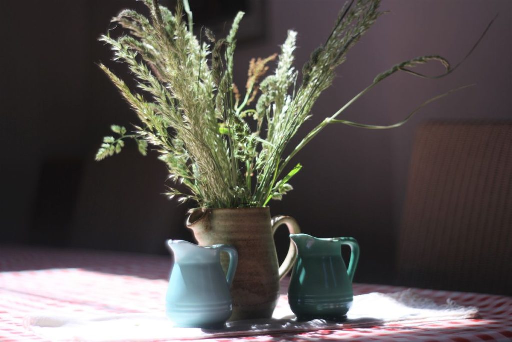 arrangement of dried grasses on table