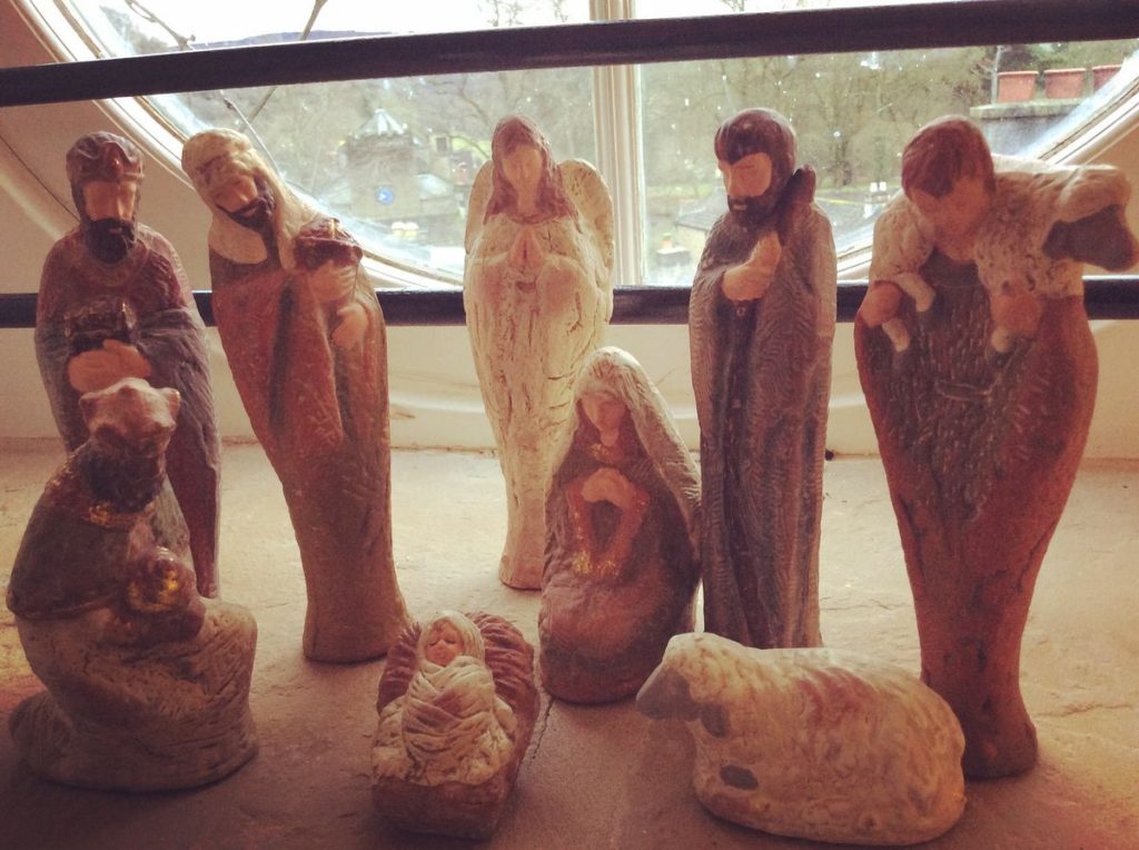 an advent display of ceramic nativity scene figures 